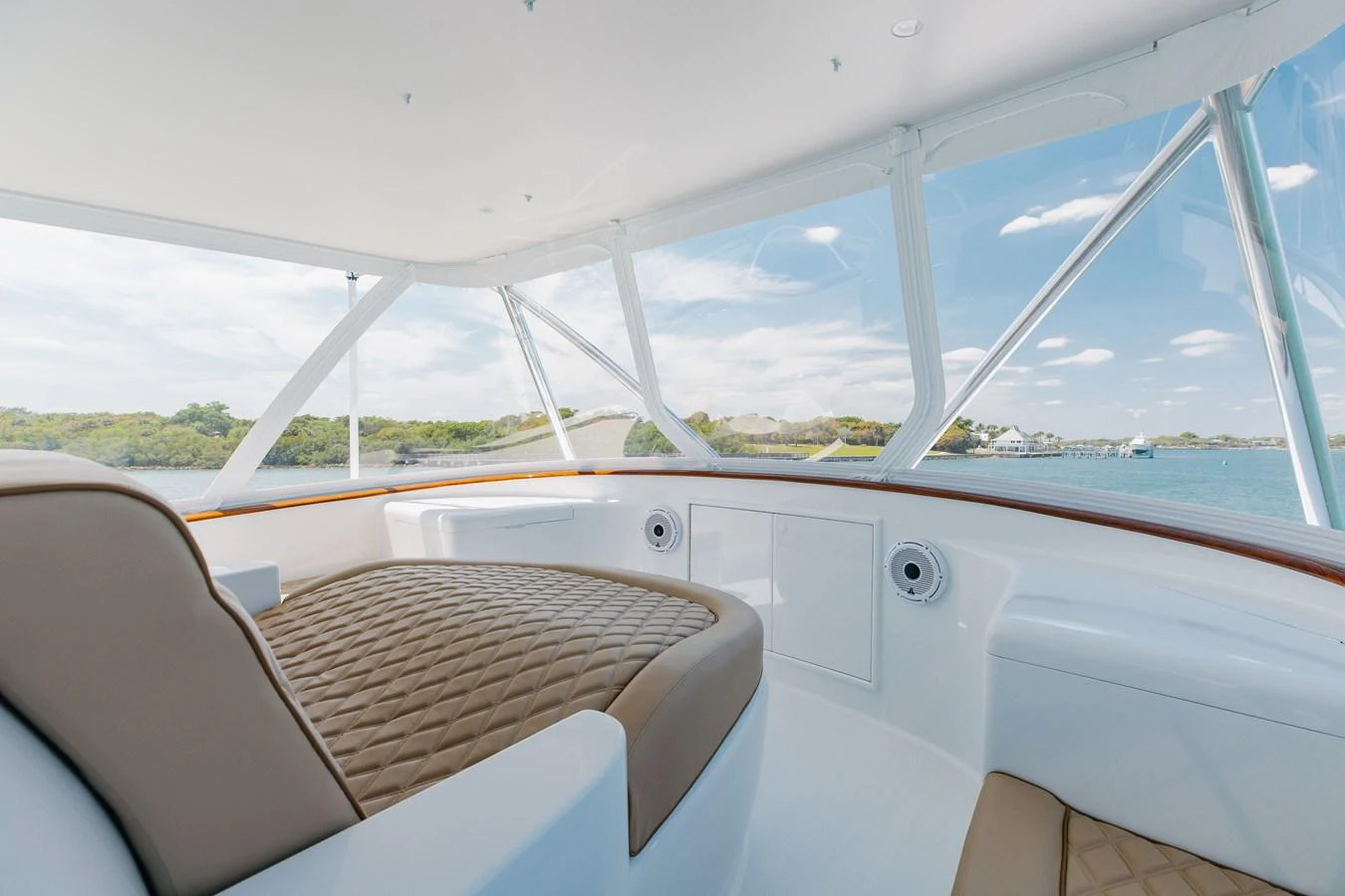 The helm area offers a panoramic view with luxurious seating and elegant design. aboard QUEEN BEE Yacht for Sale