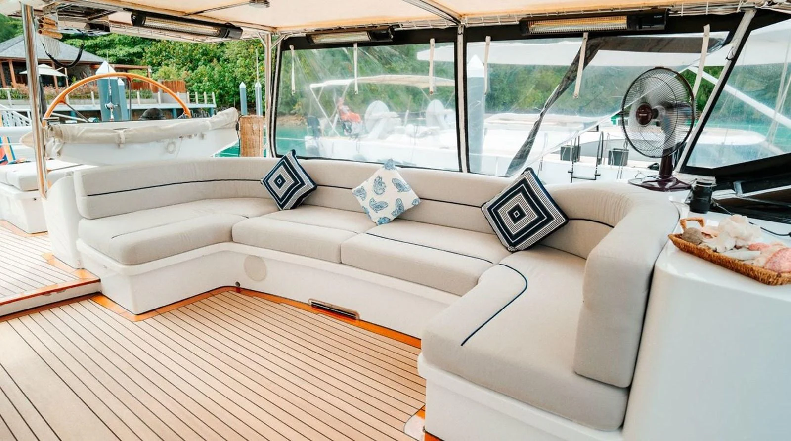 The aft deck features a spacious and comfortable seating area with plush cushions and stylish decor. aboard THANDEKA Yacht for Sale