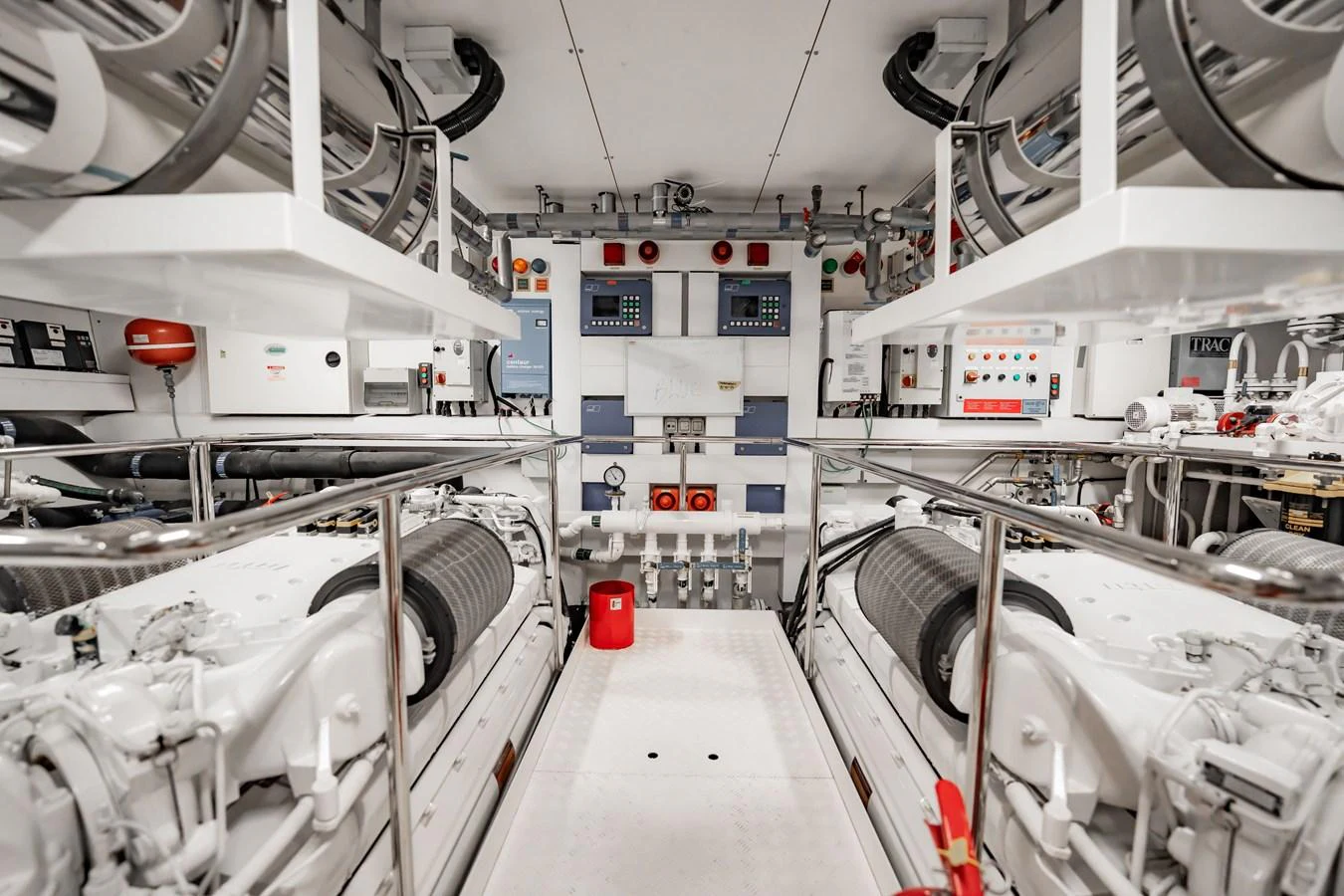 The engine room showcases a meticulously organized and well-maintained space with advanced machinery and control panels. aboard BLUE Yacht for Sale