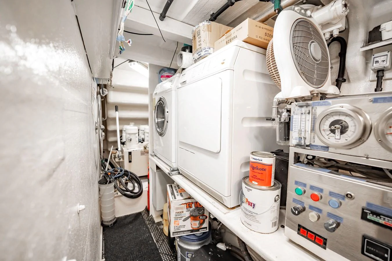 The yacht's laundry room is equipped with essential appliances and storage for maintenance supplies. aboard BLUE Yacht for Sale