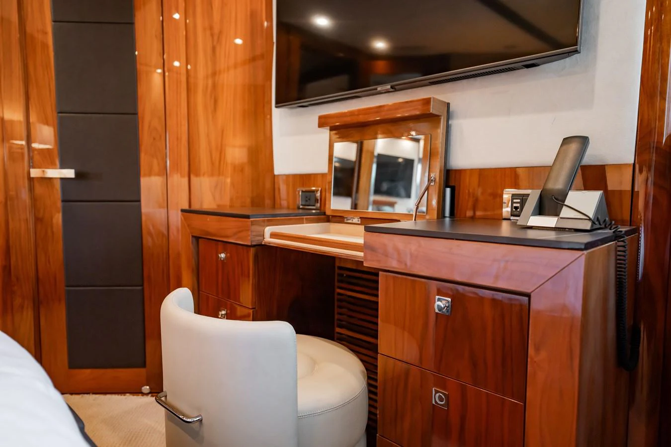 A luxurious stateroom vanity area with rich wood finishes and modern amenities. aboard BLUE Yacht for Sale