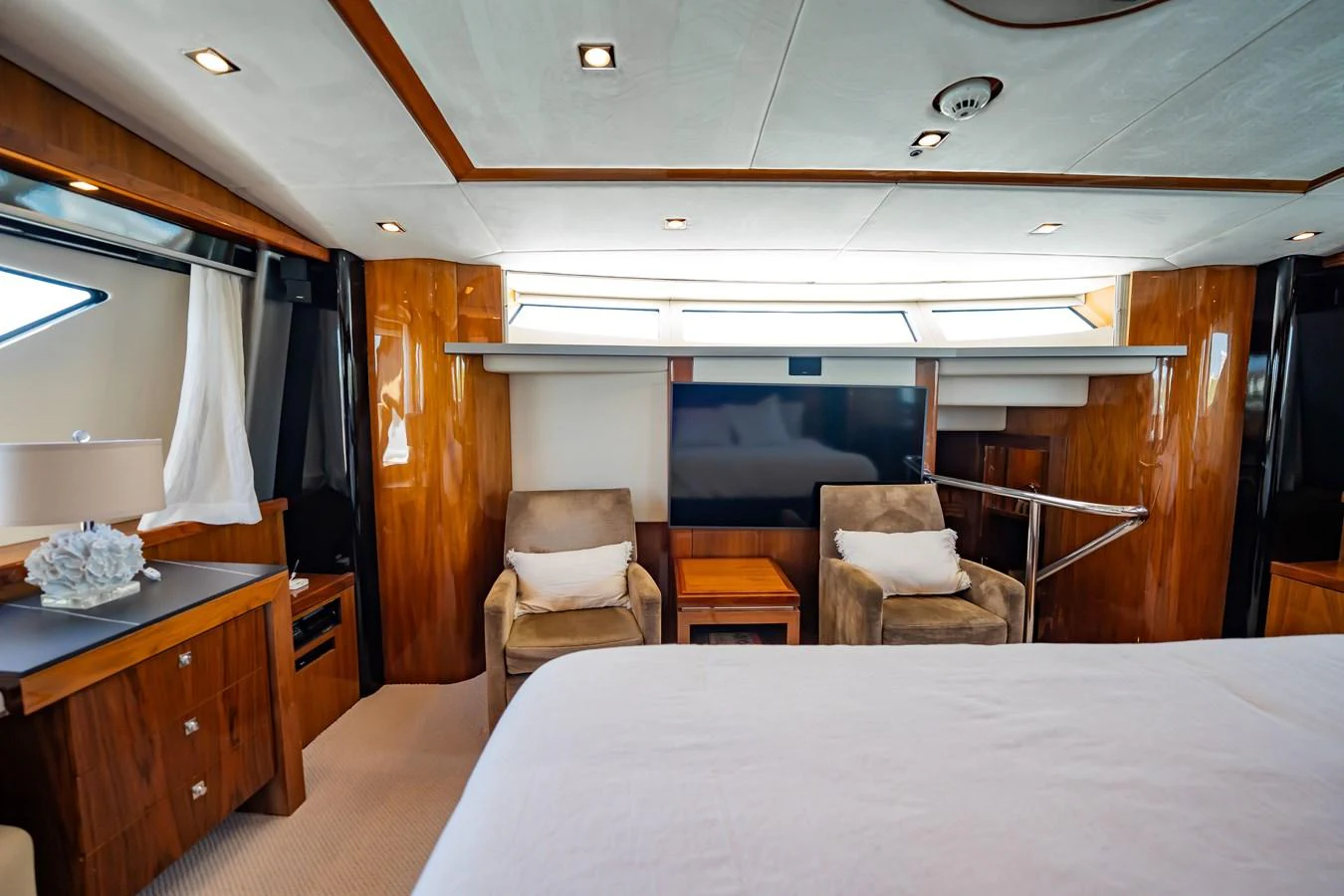 The master stateroom features luxurious seating and elegant wood finishes. aboard BLUE Yacht for Sale