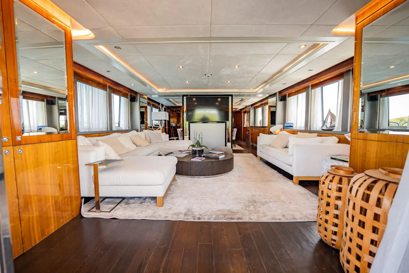 The yacht's salon features plush seating, a central coffee table, and elegant decor, creating a luxurious and inviting atmosphere. aboard BLUE Yacht for Sale