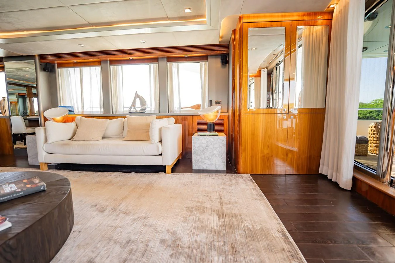 The yacht's salon features a luxurious seating area with modern decor and ample natural light. aboard BLUE Yacht for Sale