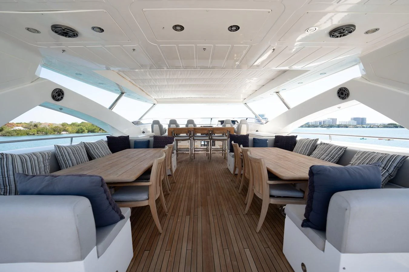 The aft deck features spacious seating and dining areas with a beautiful view of the surroundings. aboard BLUE Yacht for Sale