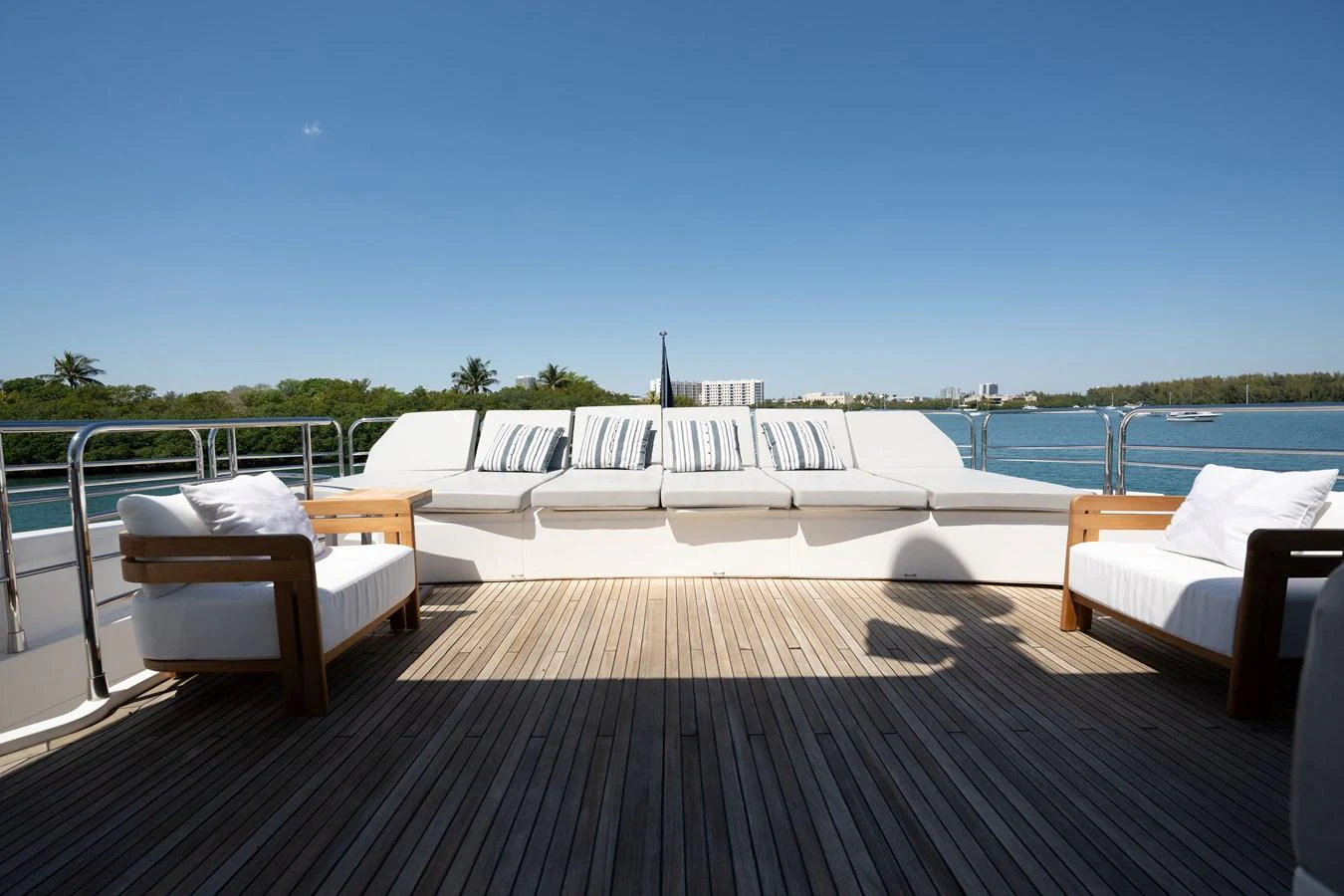 The sundeck offers a spacious and inviting area with comfortable seating and scenic views. aboard BLUE Yacht for Sale