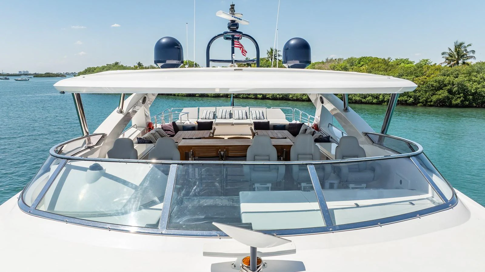 The flybridge offers a spacious and inviting area for relaxation and entertainment with a stunning view of the water. aboard BLUE Yacht for Sale