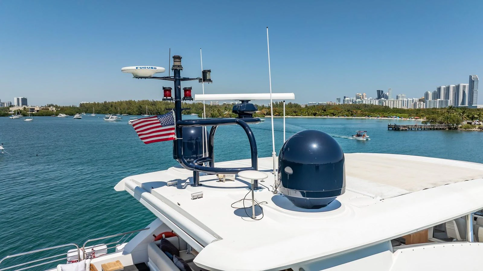 The flybridge features advanced navigation equipment and a stunning view of the surrounding waters and cityscape. aboard BLUE Yacht for Sale