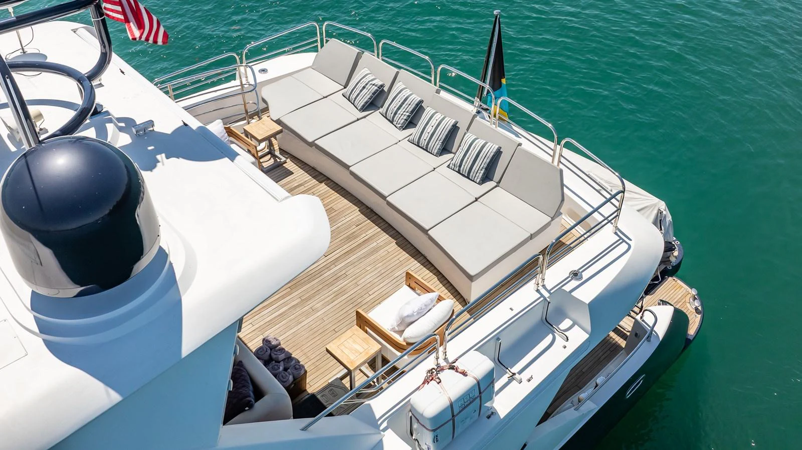 The aft deck features a spacious lounging area with comfortable seating and scenic views over the water. aboard BLUE Yacht for Sale