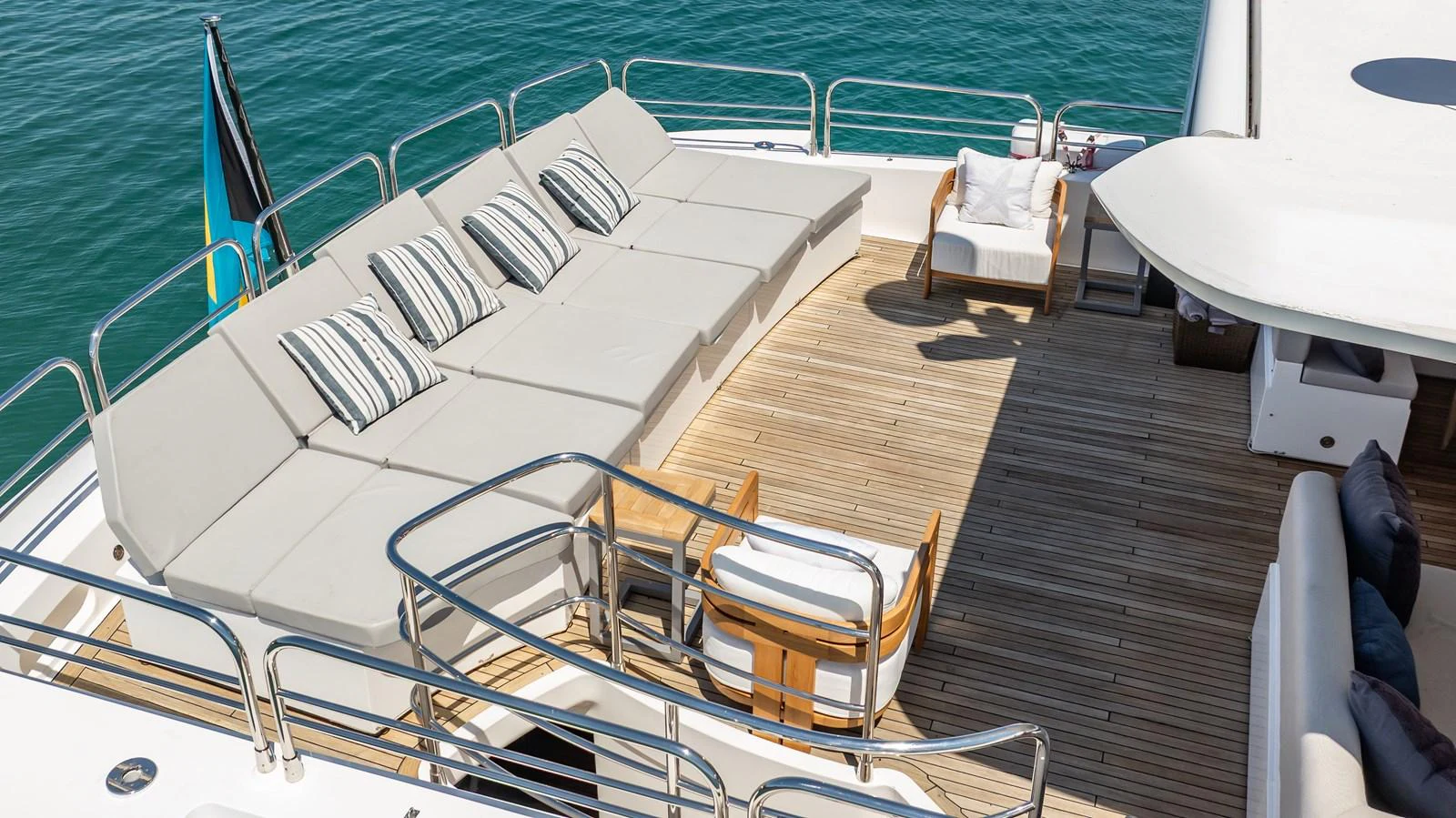 The sundeck offers luxurious lounging with plush sunbeds and a stunning view of the water. aboard BLUE Yacht for Sale