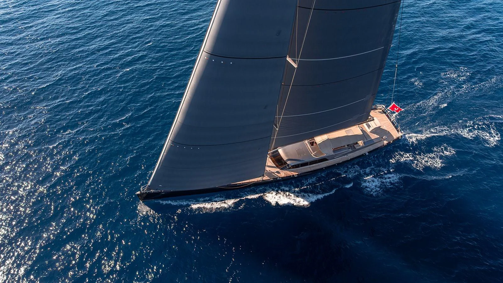 A sleek sailing yacht glides gracefully across the open sea under full sail. aboard 4K Yacht for Sale