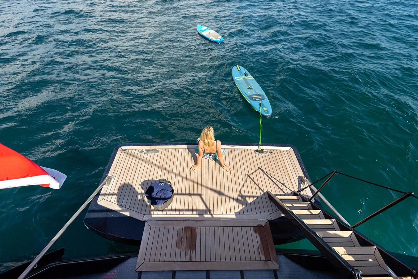 The yacht's swim platform offers direct access to the water, perfect for enjoying water sports and relaxation. aboard 4K Yacht for Sale