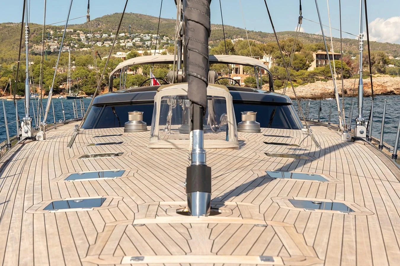 The yacht's deck showcases elegant teak wood and sleek design elements, perfect for luxurious sailing. aboard 4K Yacht for Sale