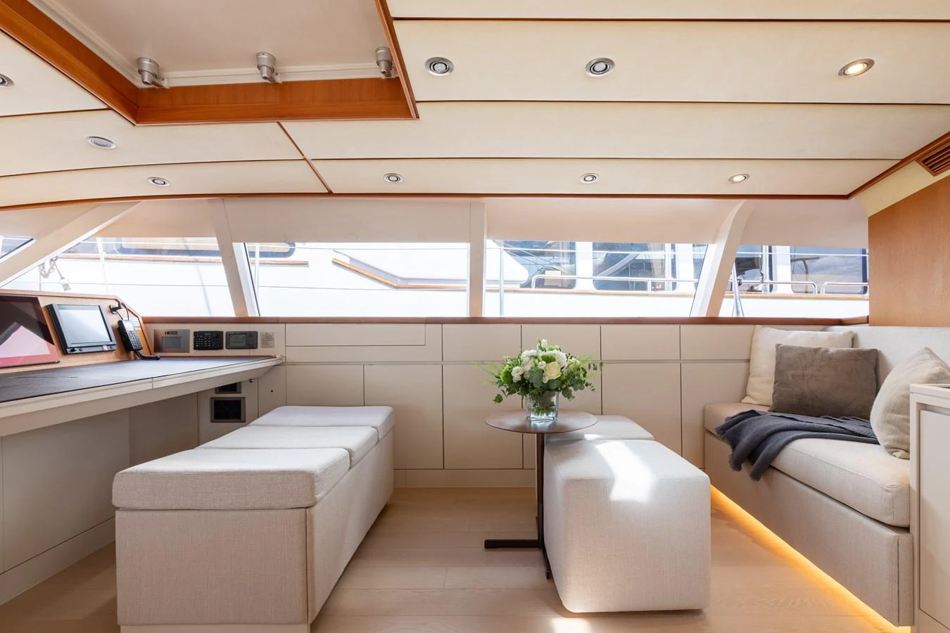 The salon features a bright and inviting space with comfortable seating and elegant decor. aboard 4K Yacht for Sale
