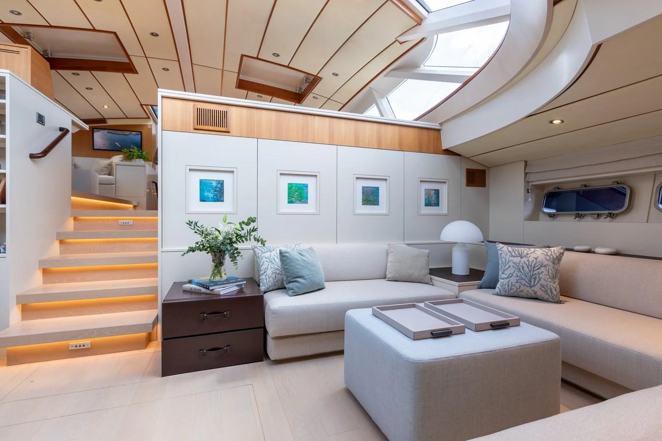 The salon features a modern and spacious design with ample natural light and comfortable seating. aboard 4K Yacht for Sale