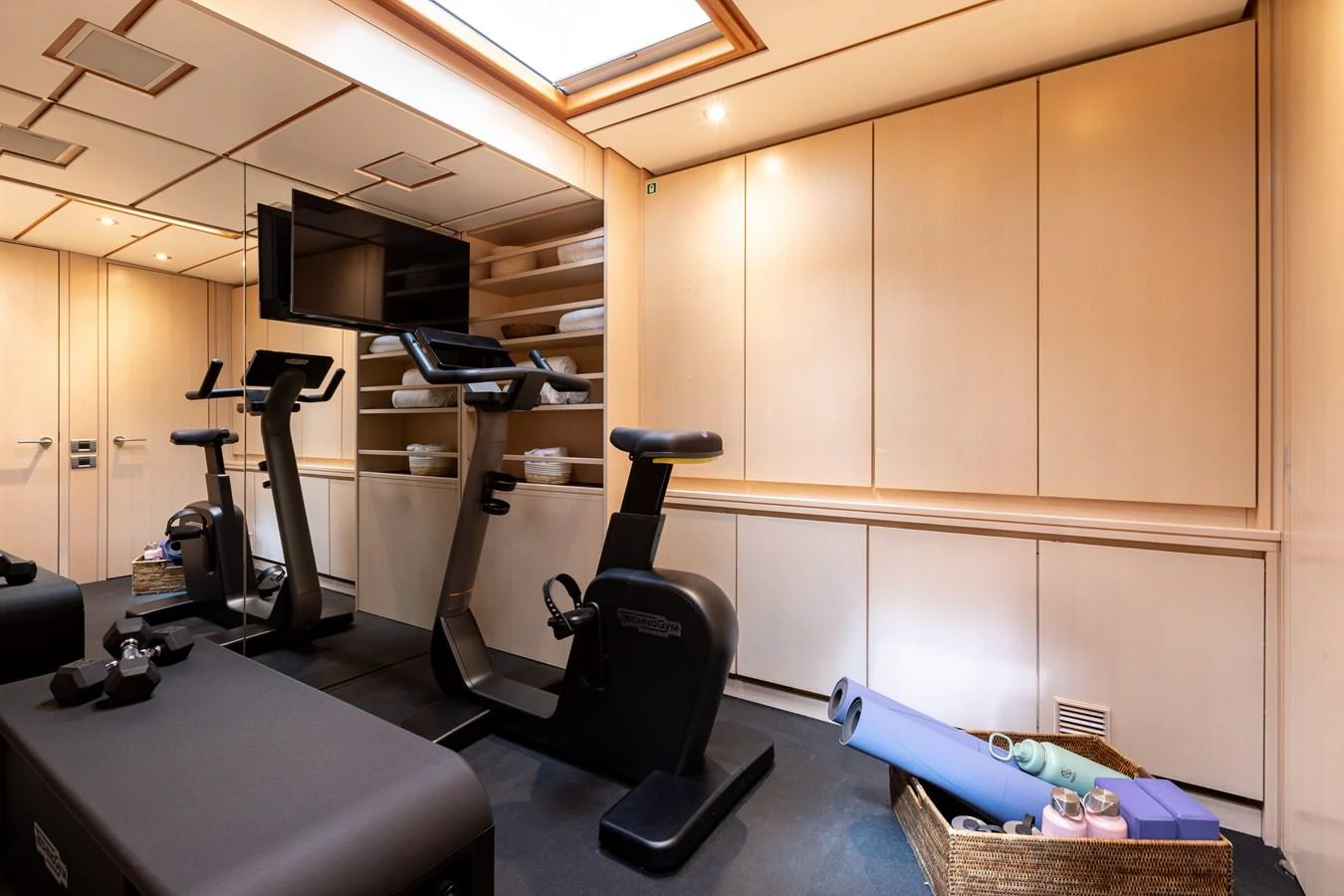 The yacht features a well-equipped gym with modern exercise equipment and ample storage space. aboard 4K Yacht for Sale