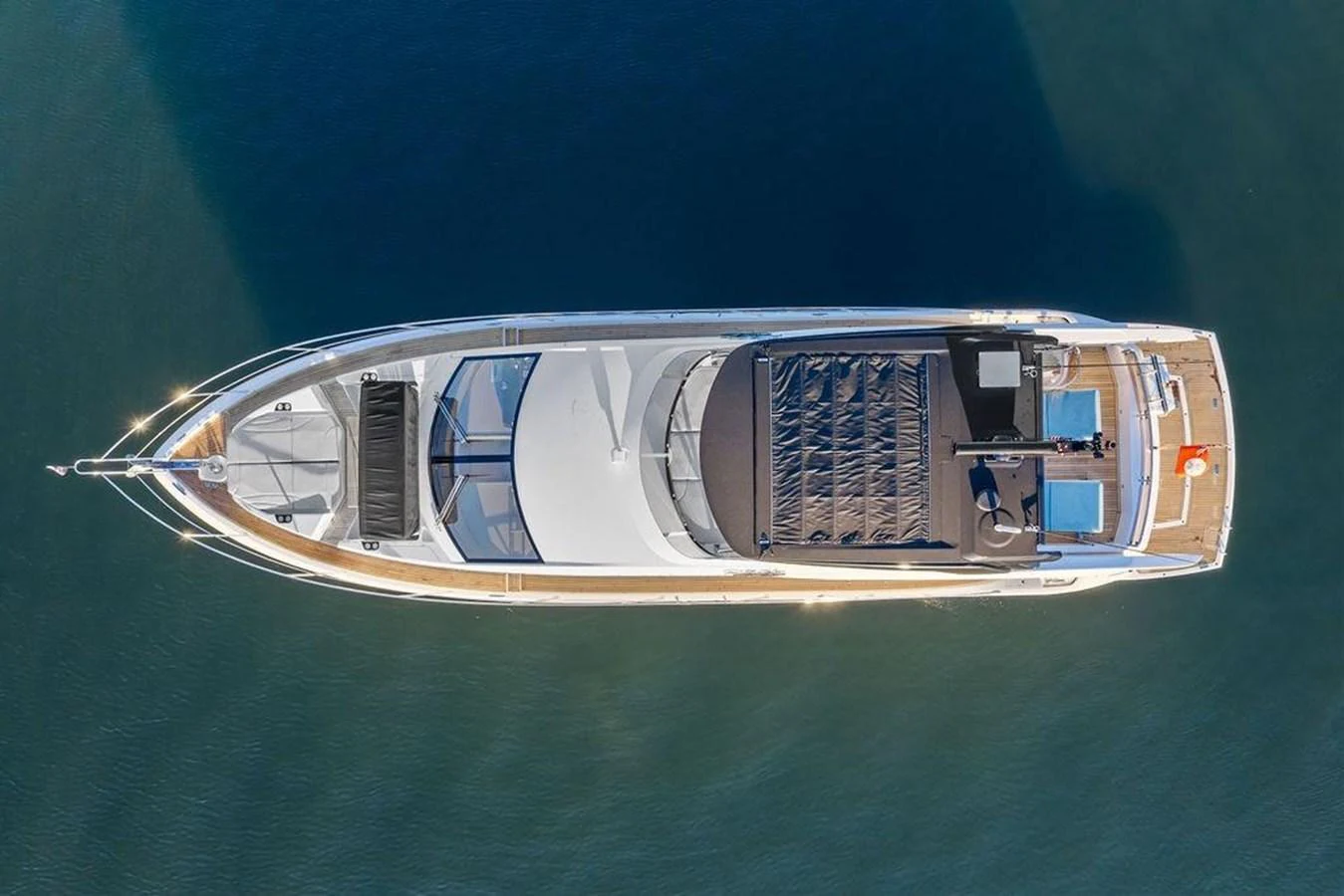 Aerial view of a sleek yacht showcasing its spacious deck and modern design. aboard ELLIGANCE Yacht for Sale