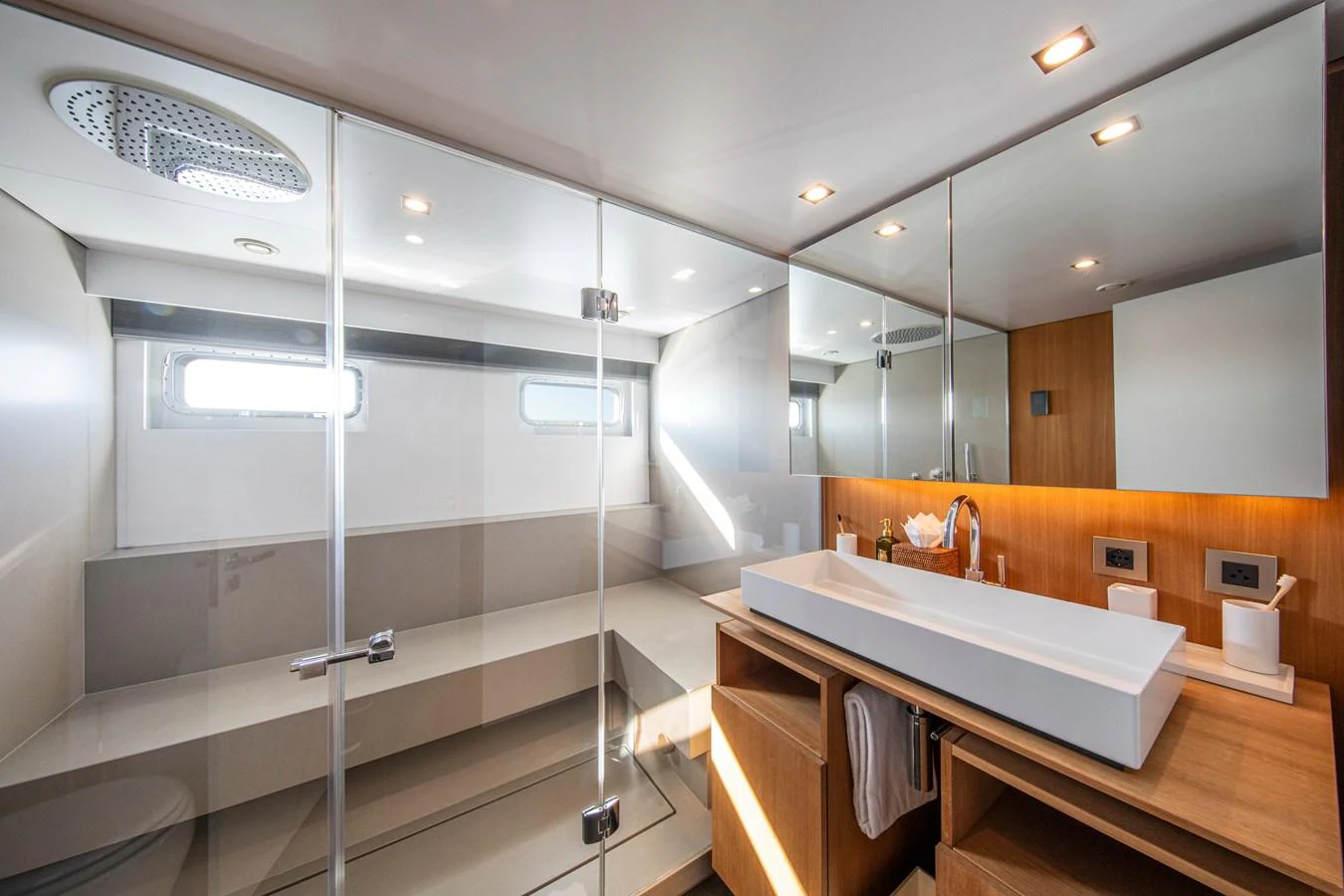 The yacht's bathroom features modern fixtures and a spacious, well-lit design. aboard PLAYA Yacht for Sale