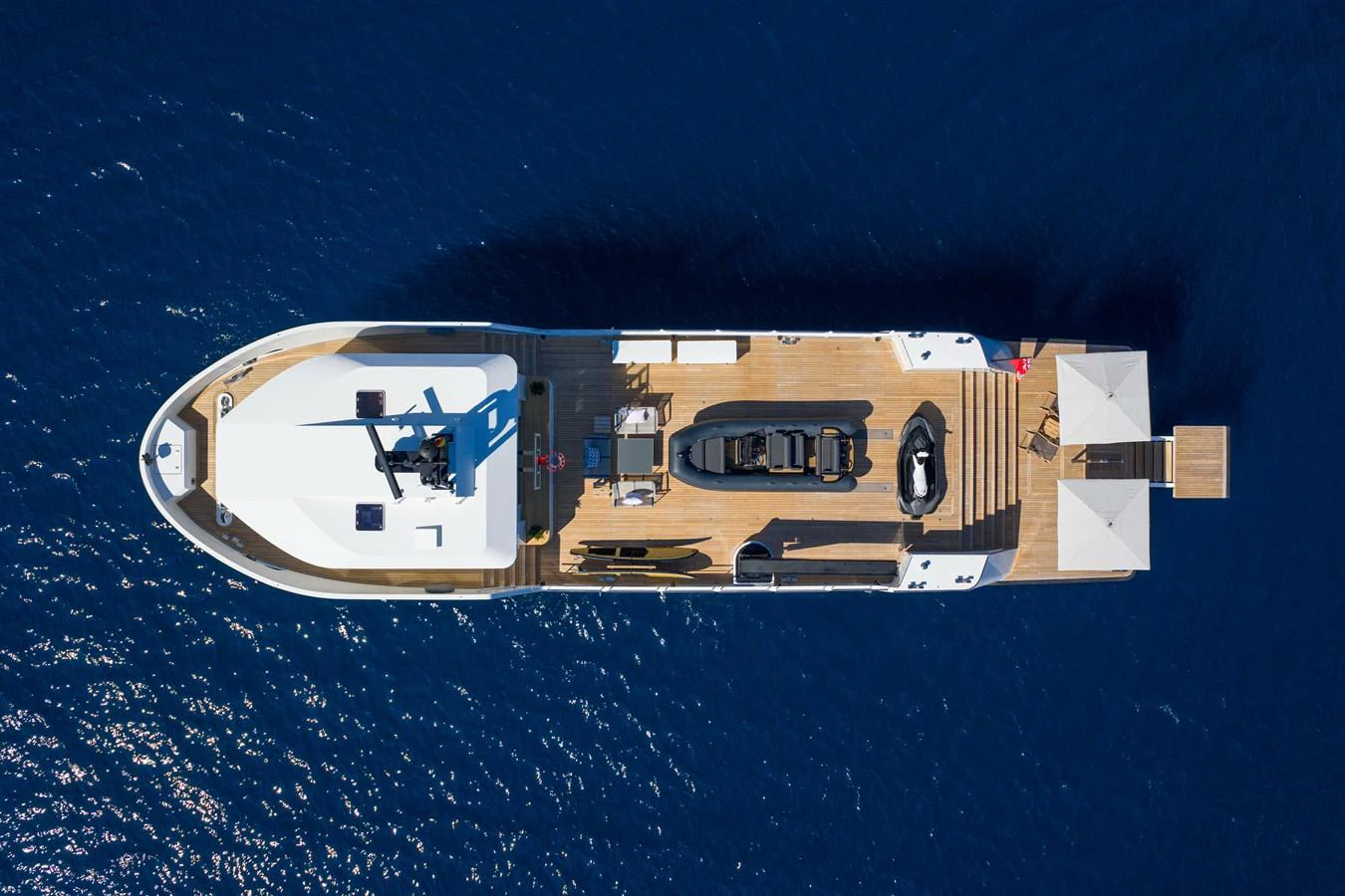 Aerial view of the yacht's top deck showcasing its spacious layout and amenities. aboard PLAYA Yacht for Sale
