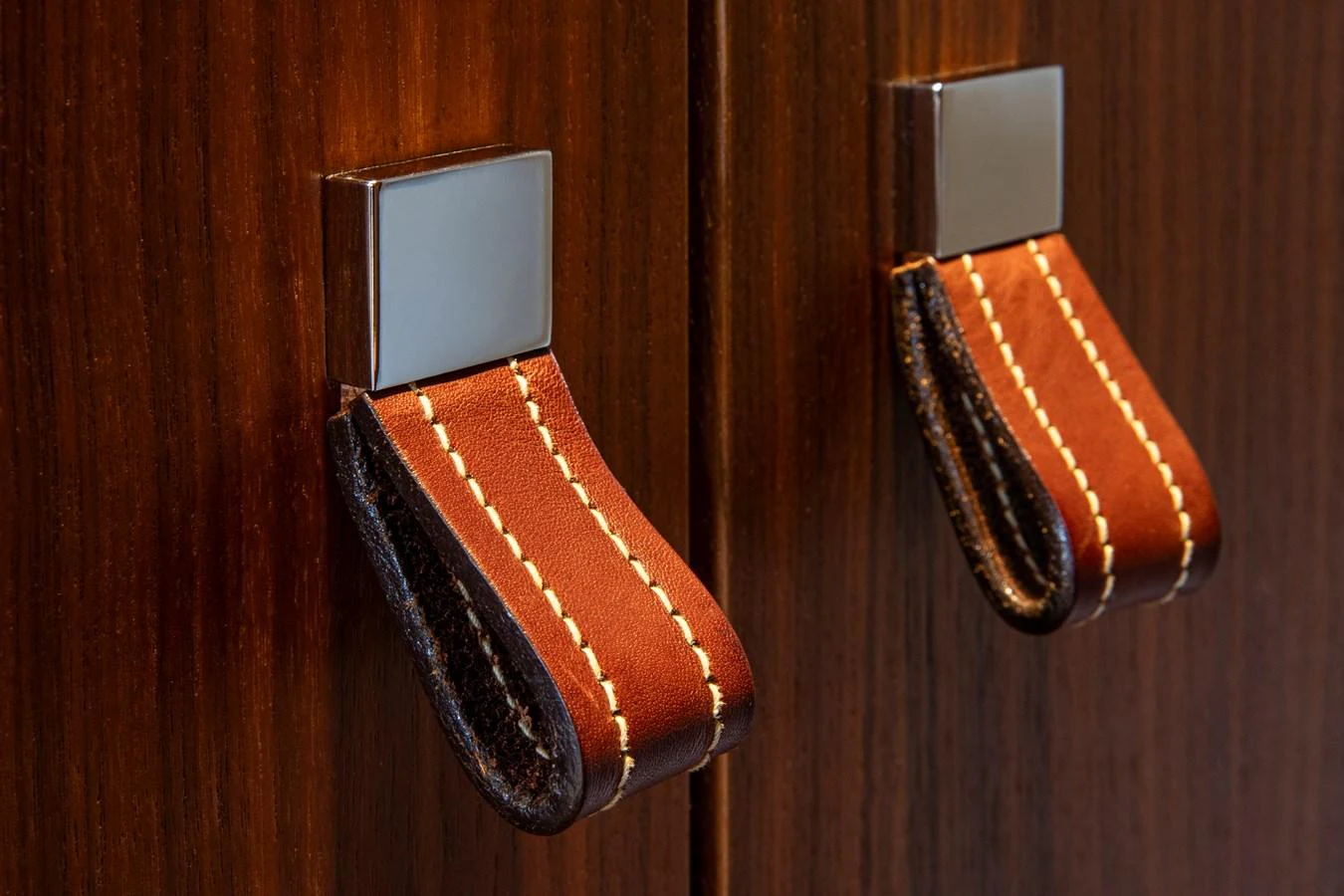 Elegant leather and metal handles adorn the yacht's cabinetry. aboard PLAYA Yacht for Sale