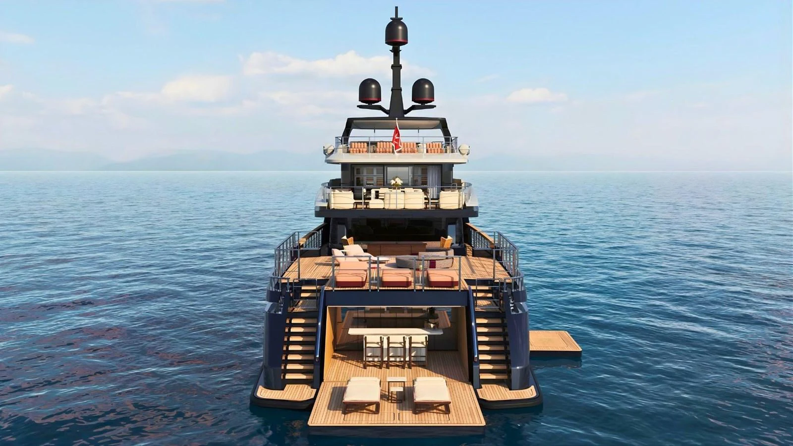 The yacht features a luxurious aft deck with multiple lounging areas and direct access to the water. aboard CASA F Yacht for Sale
