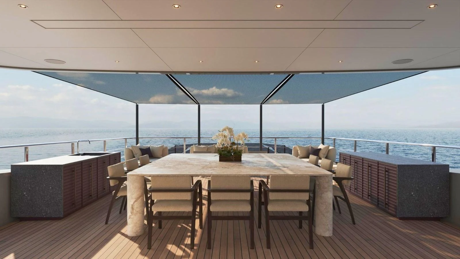 The aft deck offers a luxurious dining area with panoramic ocean views. aboard CASA F Yacht for Sale