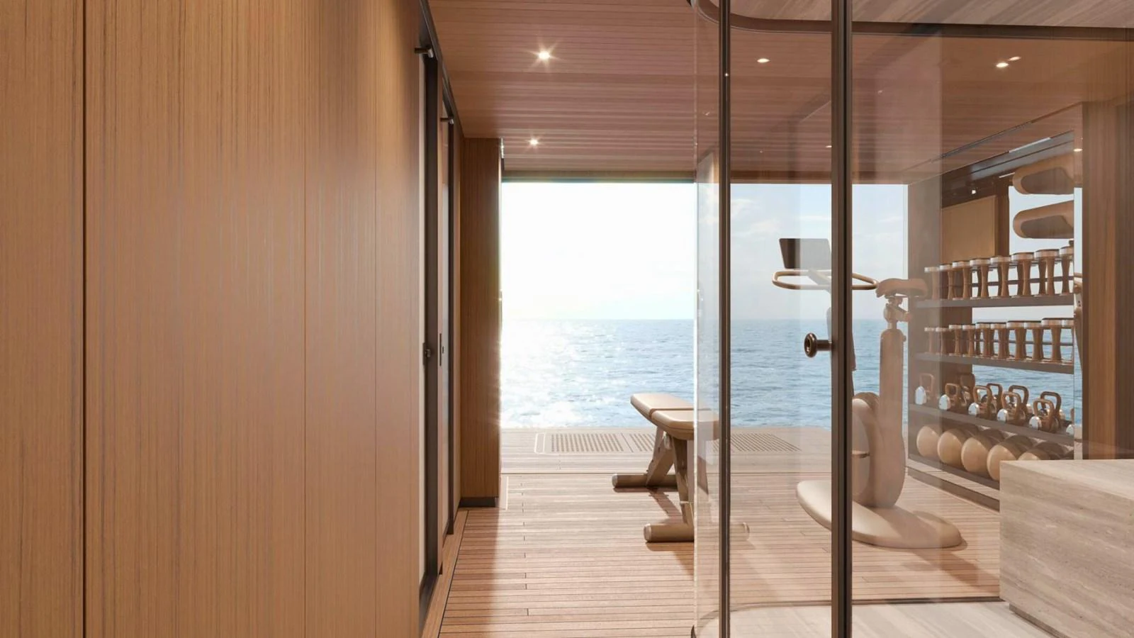 The yacht's gym features modern equipment and a serene ocean view. aboard CASA F Yacht for Sale