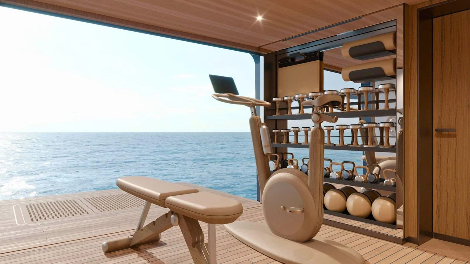 The yacht features a well-equipped gym with a stunning ocean view. aboard CASA F Yacht for Sale