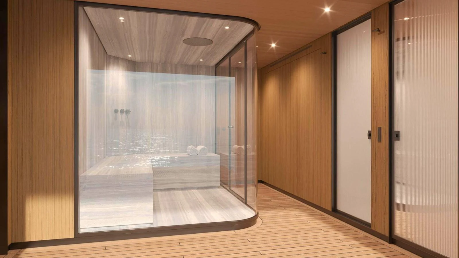 The interior features a luxurious sauna with glass walls and warm wooden finishes. aboard CASA F Yacht for Sale