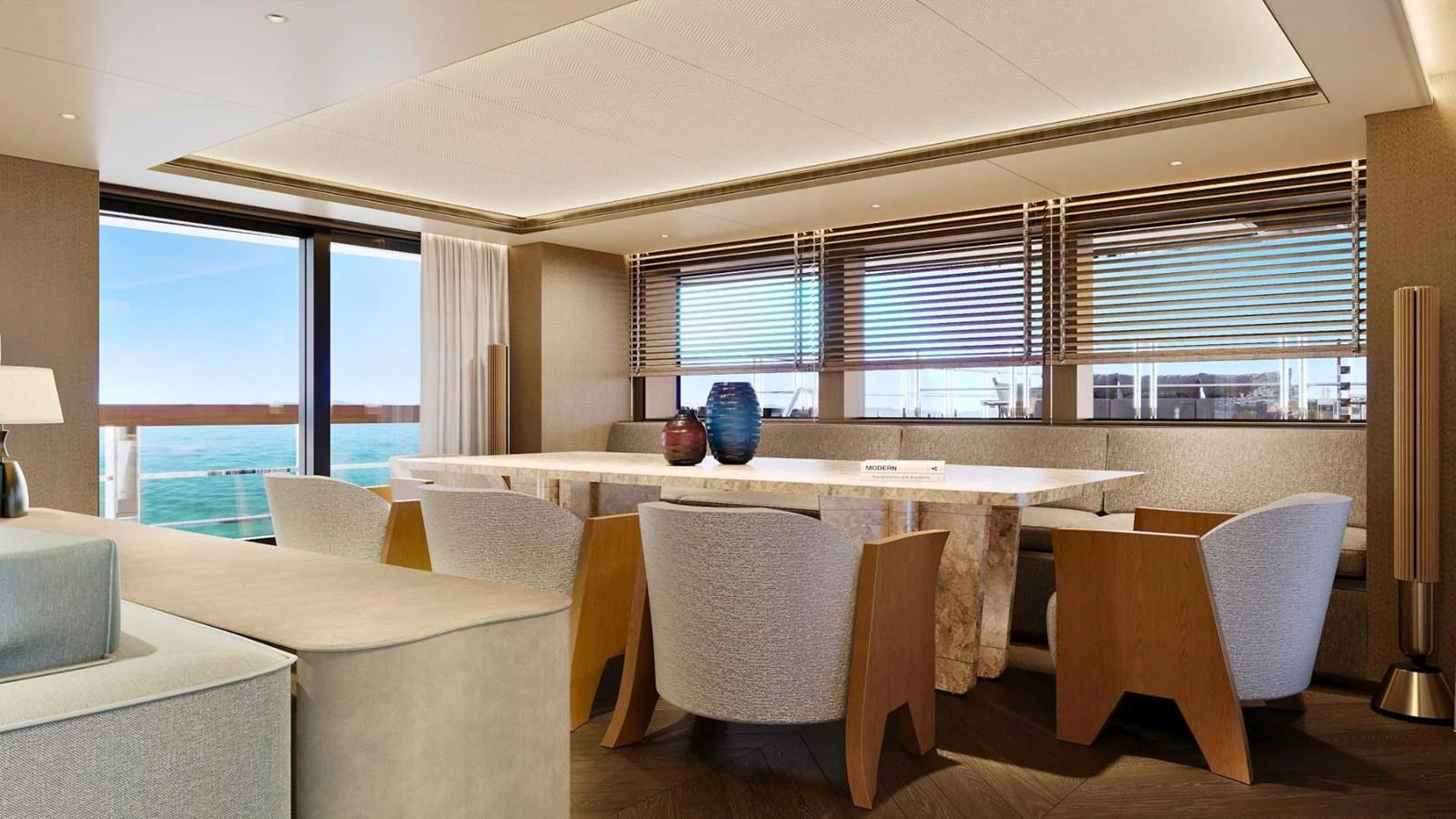 The yacht's dining area features a sleek, modern design with large windows offering stunning ocean views. aboard CASA F Yacht for Sale
