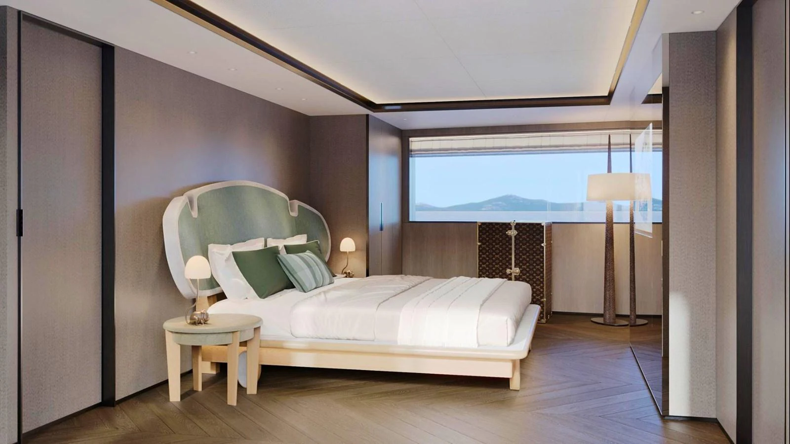 A luxurious stateroom featuring a large bed with elegant furnishings and a scenic view through the window. aboard CASA F Yacht for Sale