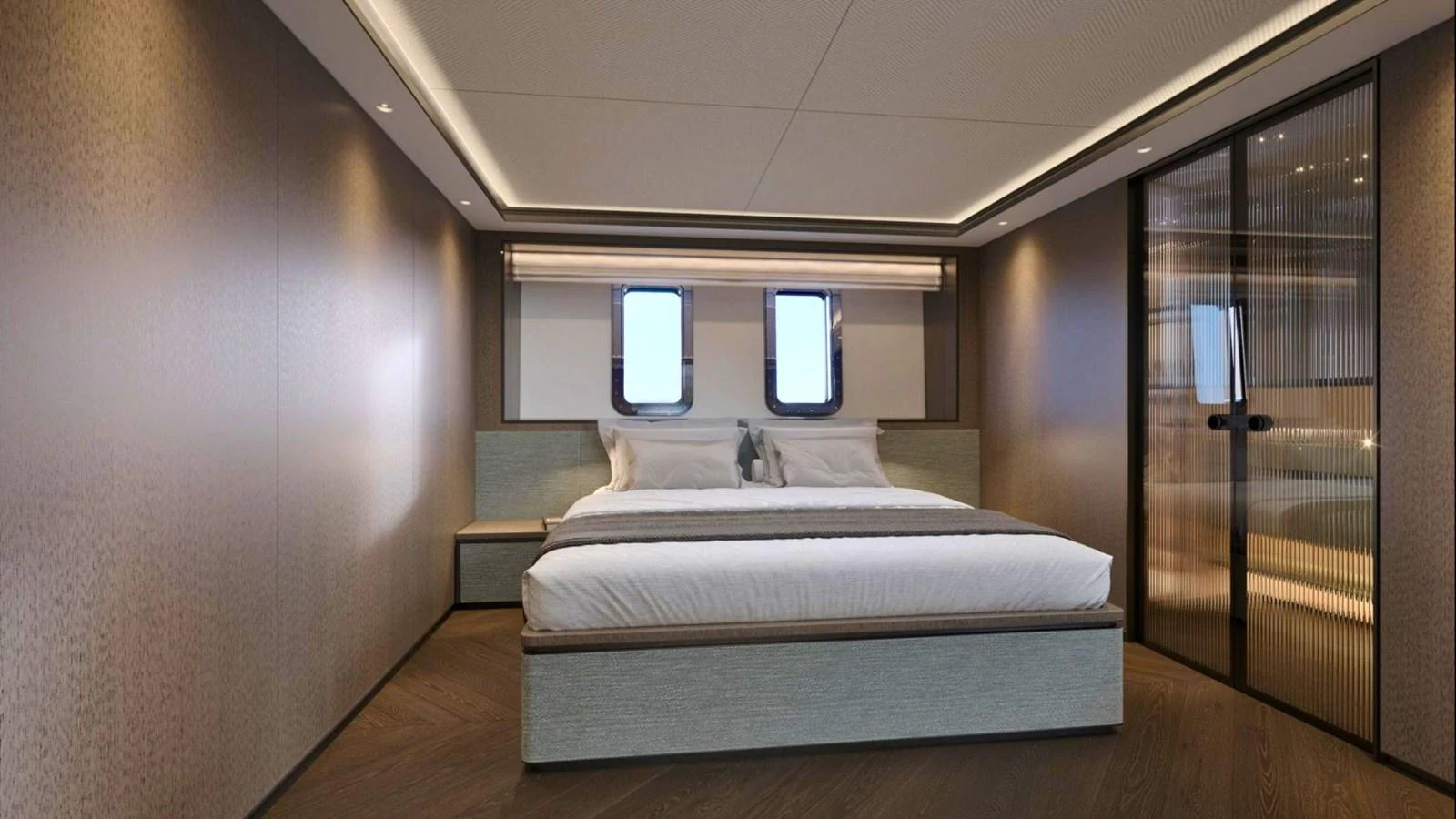 The stateroom features a luxurious bed with modern decor and ample natural light from the windows. aboard CASA F Yacht for Sale