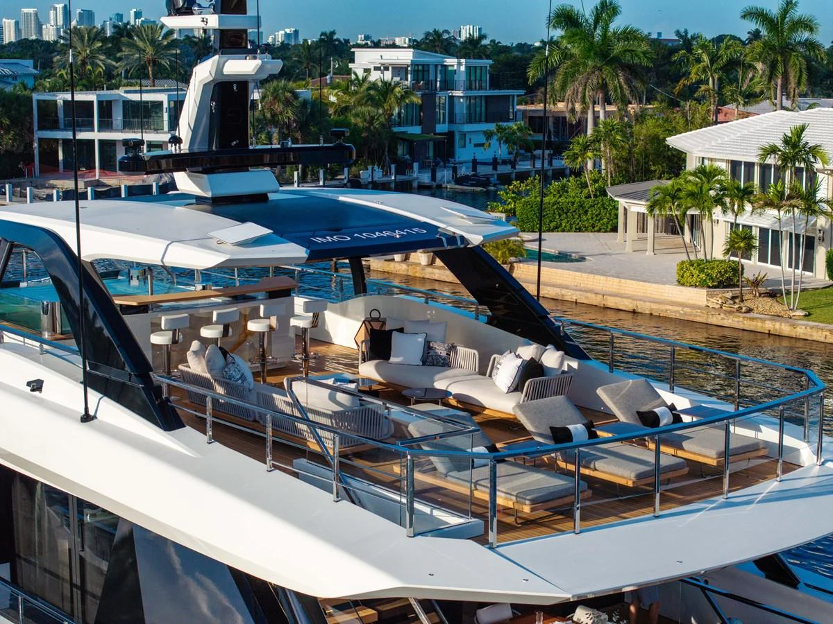 The yacht's flybridge offers a luxurious outdoor lounging area with plush seating and scenic views. aboard BAGLIETTO DOM 133 #5 Yacht for Sale