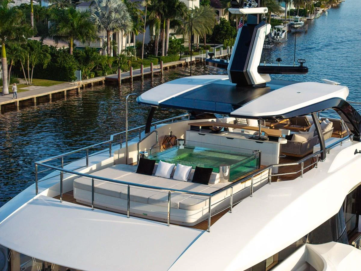 The yacht features a luxurious sundeck with ample seating and a jacuzzi, perfect for relaxation. aboard BAGLIETTO DOM 133 #5 Yacht for Sale