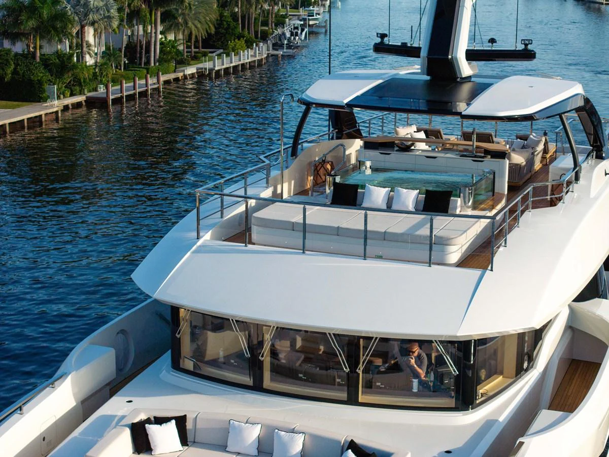 The yacht features a luxurious sundeck with ample seating and a jacuzzi, perfect for relaxation. aboard BAGLIETTO DOM 133 #5 Yacht for Sale