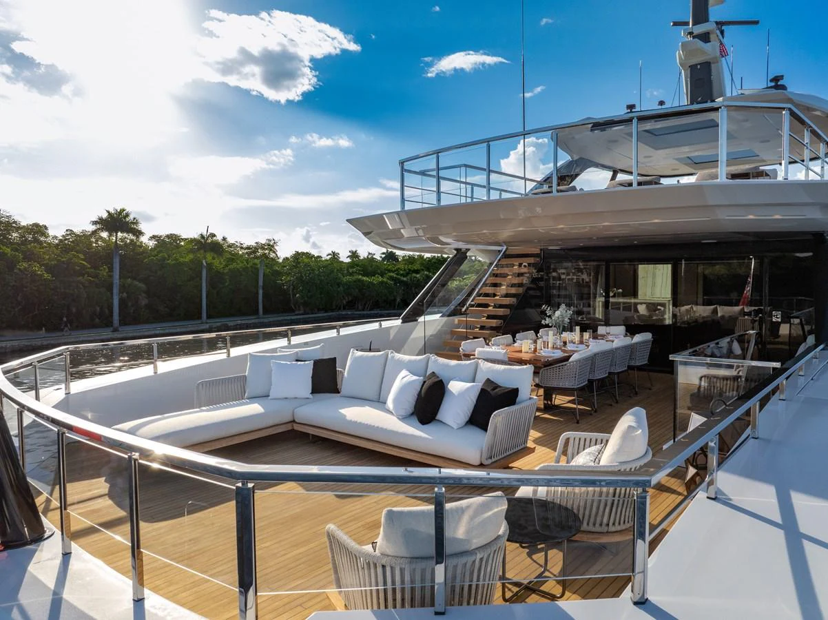 The aft deck features a spacious and elegant outdoor seating and dining area, perfect for relaxation and entertainment. aboard BAGLIETTO DOM 133 #5 Yacht for Sale