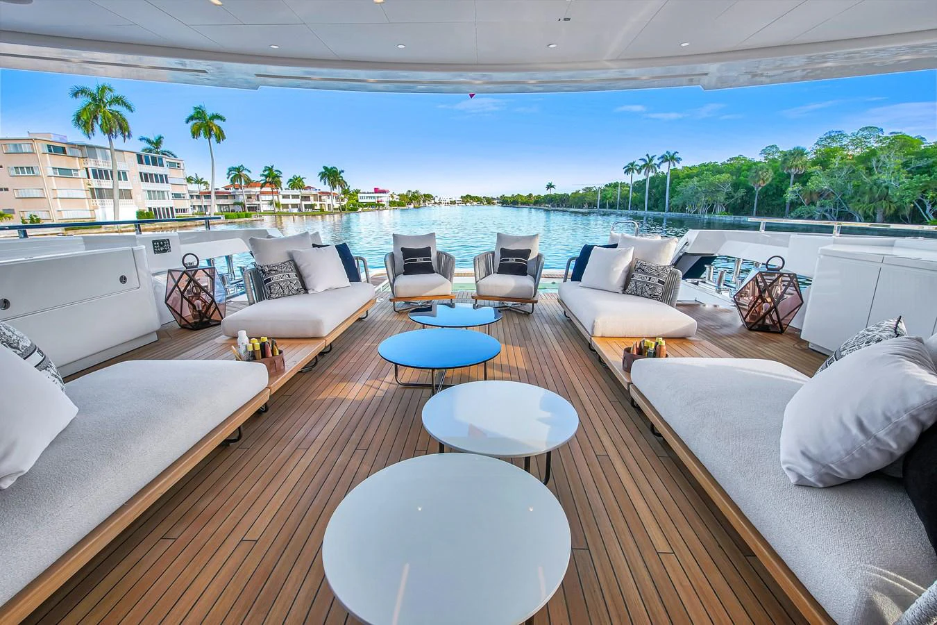 The aft deck offers a luxurious lounging area with plush seating and stunning waterfront views. aboard BAGLIETTO DOM 133 #5 Yacht for Sale