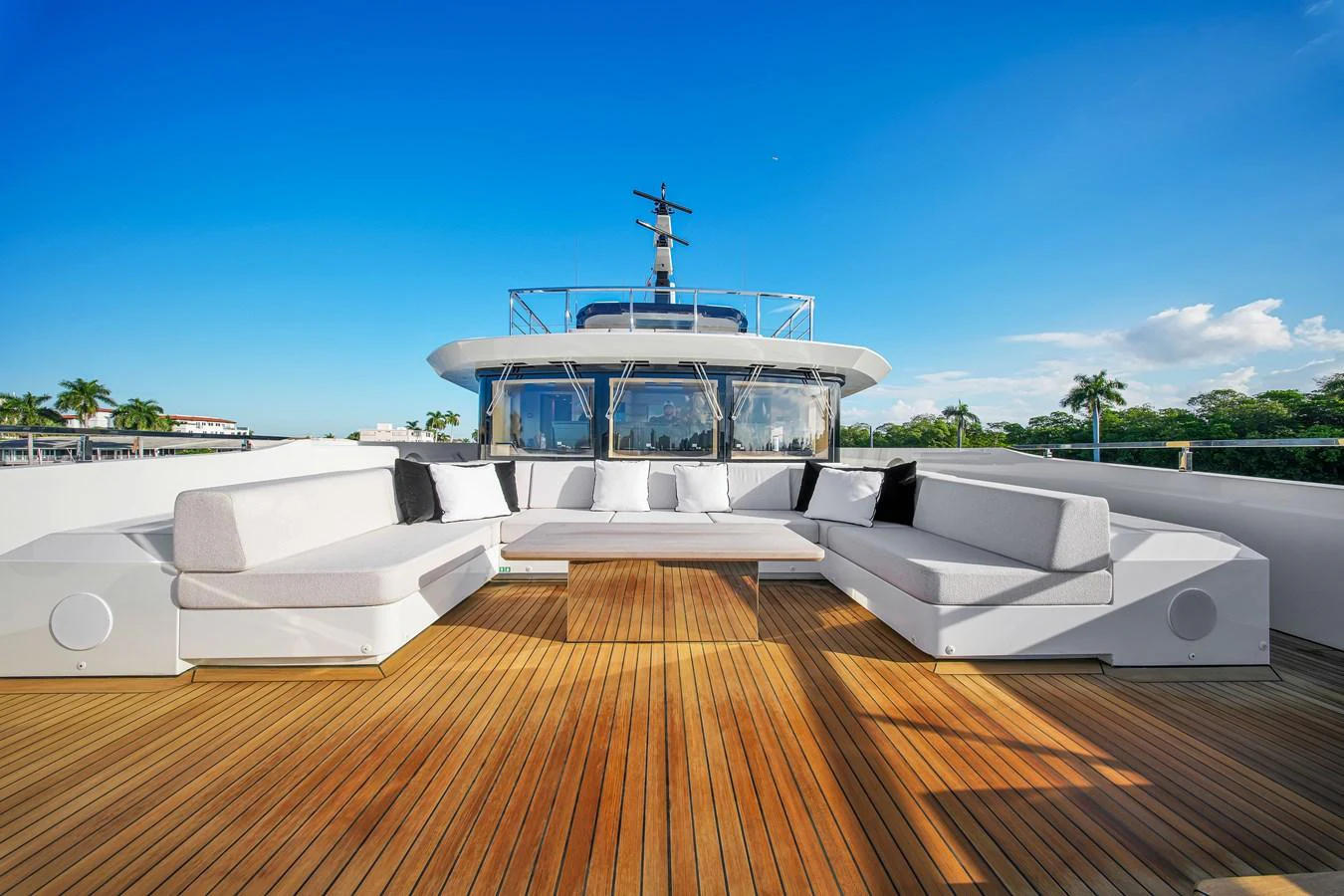 The yacht's sundeck features a spacious seating area with plush cushions, perfect for relaxation under the open sky. aboard BAGLIETTO DOM 133 #5 Yacht for Sale