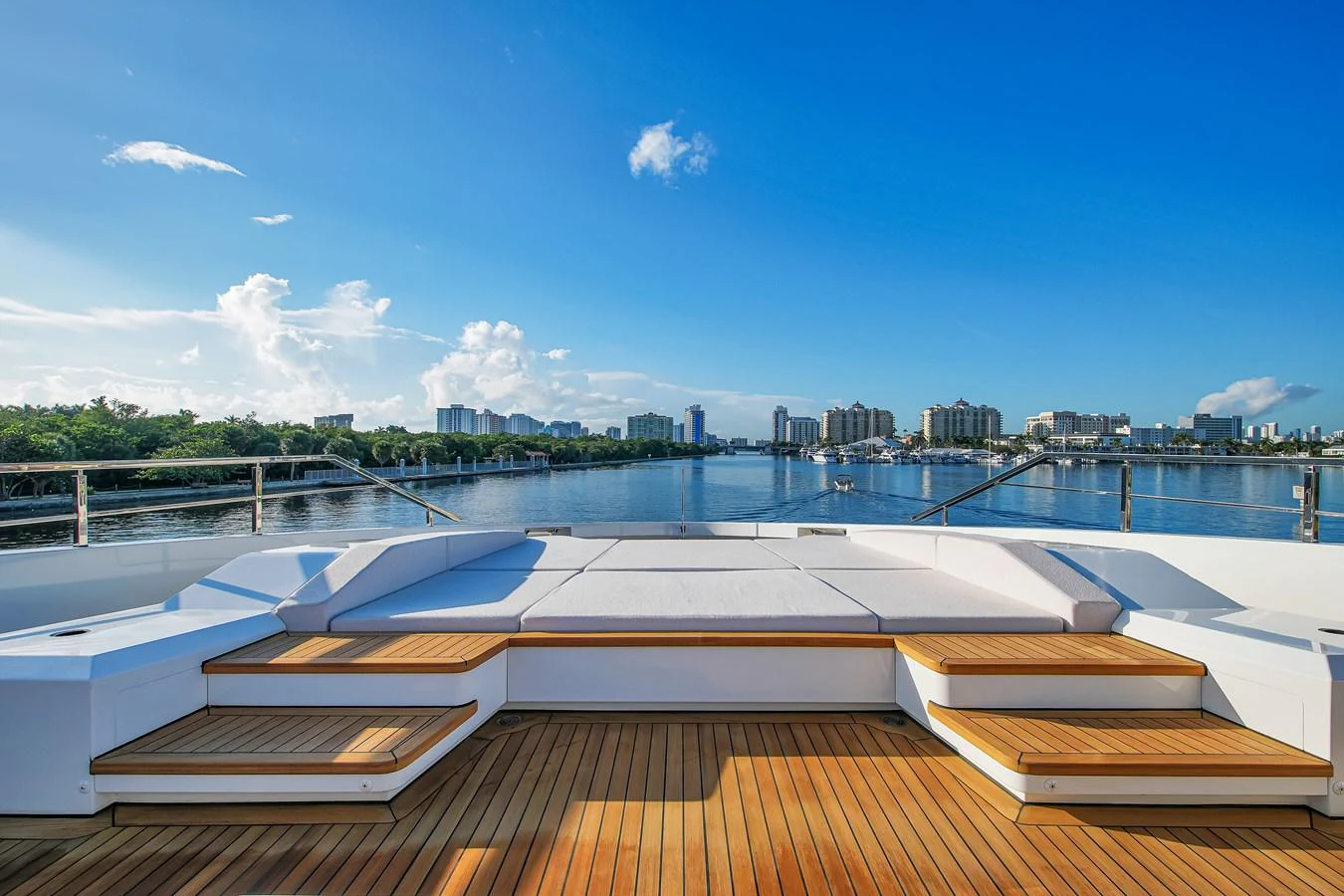 The aft deck offers a spacious and inviting area with stunning views of the water and city skyline. aboard BAGLIETTO DOM 133 #5 Yacht for Sale