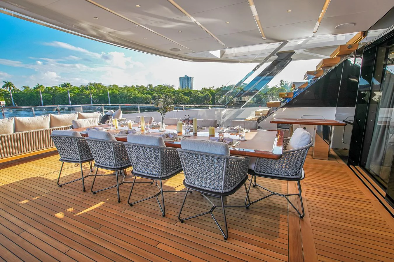 The aft deck features an elegant dining area with a large table and comfortable seating, perfect for alfresco meals. aboard BAGLIETTO DOM 133 #5 Yacht for Sale