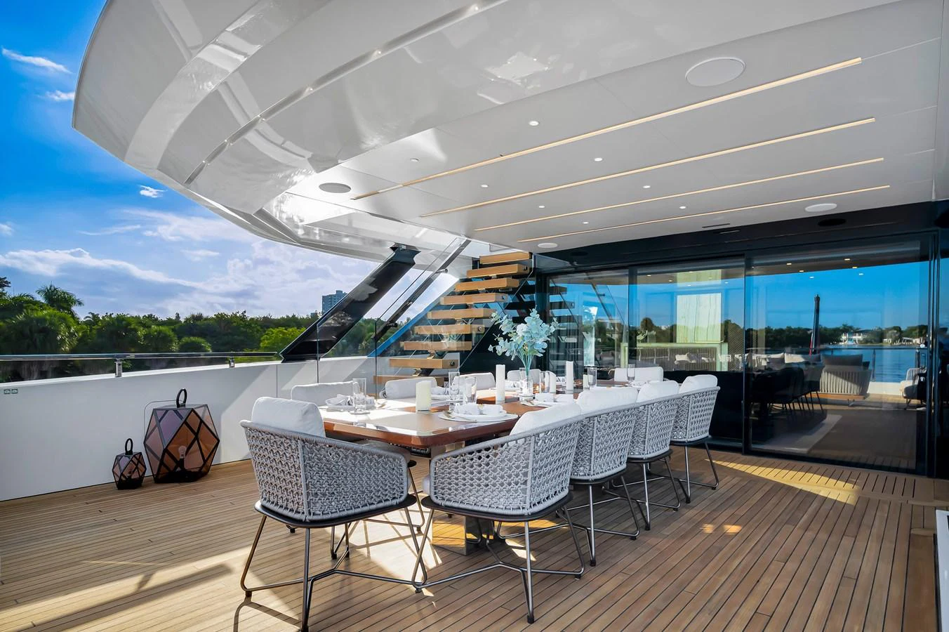 The aft deck features an elegant dining area with a large table and comfortable seating, perfect for alfresco meals. aboard BAGLIETTO DOM 133 #5 Yacht for Sale