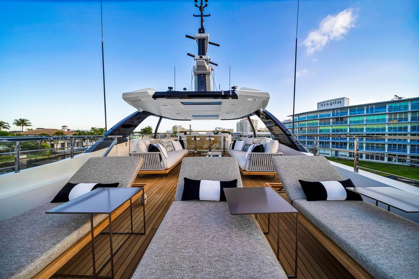 The flybridge offers a luxurious lounging area with plush sunbeds and modern tables, perfect for relaxation. aboard BAGLIETTO DOM 133 #5 Yacht for Sale