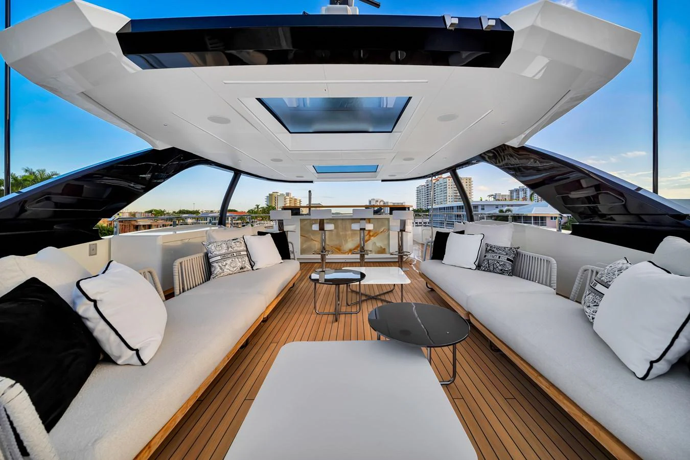 The flybridge features a spacious seating area with luxurious cushions and a modern design. aboard BAGLIETTO DOM 133 #5 Yacht for Sale
