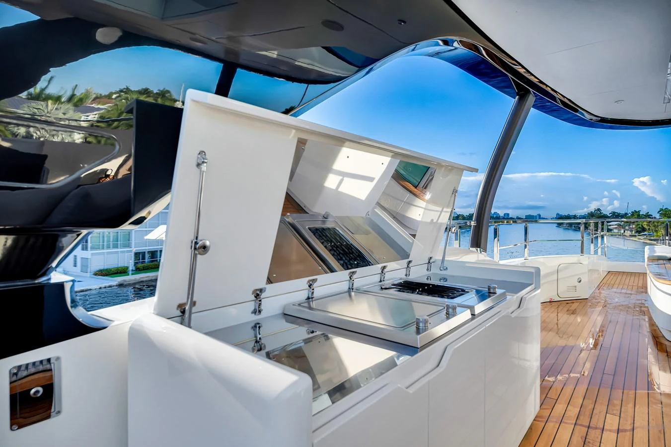 The yacht features a sleek outdoor galley with modern appliances and a stunning view. aboard BAGLIETTO DOM 133 #5 Yacht for Sale