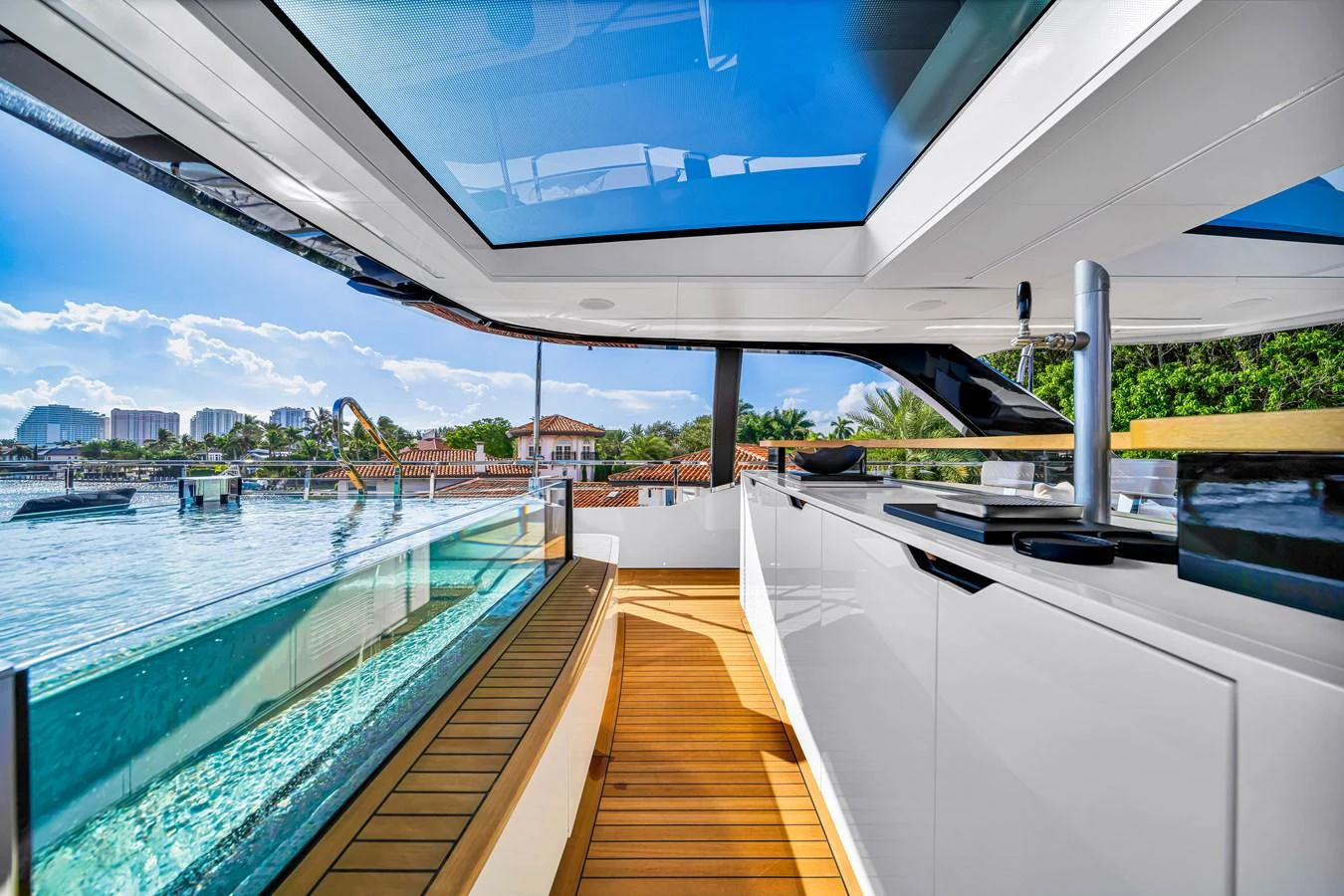 The sleek galley offers a stunning view through large windows and a skylight, blending indoor and outdoor spaces seamlessly. aboard BAGLIETTO DOM 133 #5 Yacht for Sale