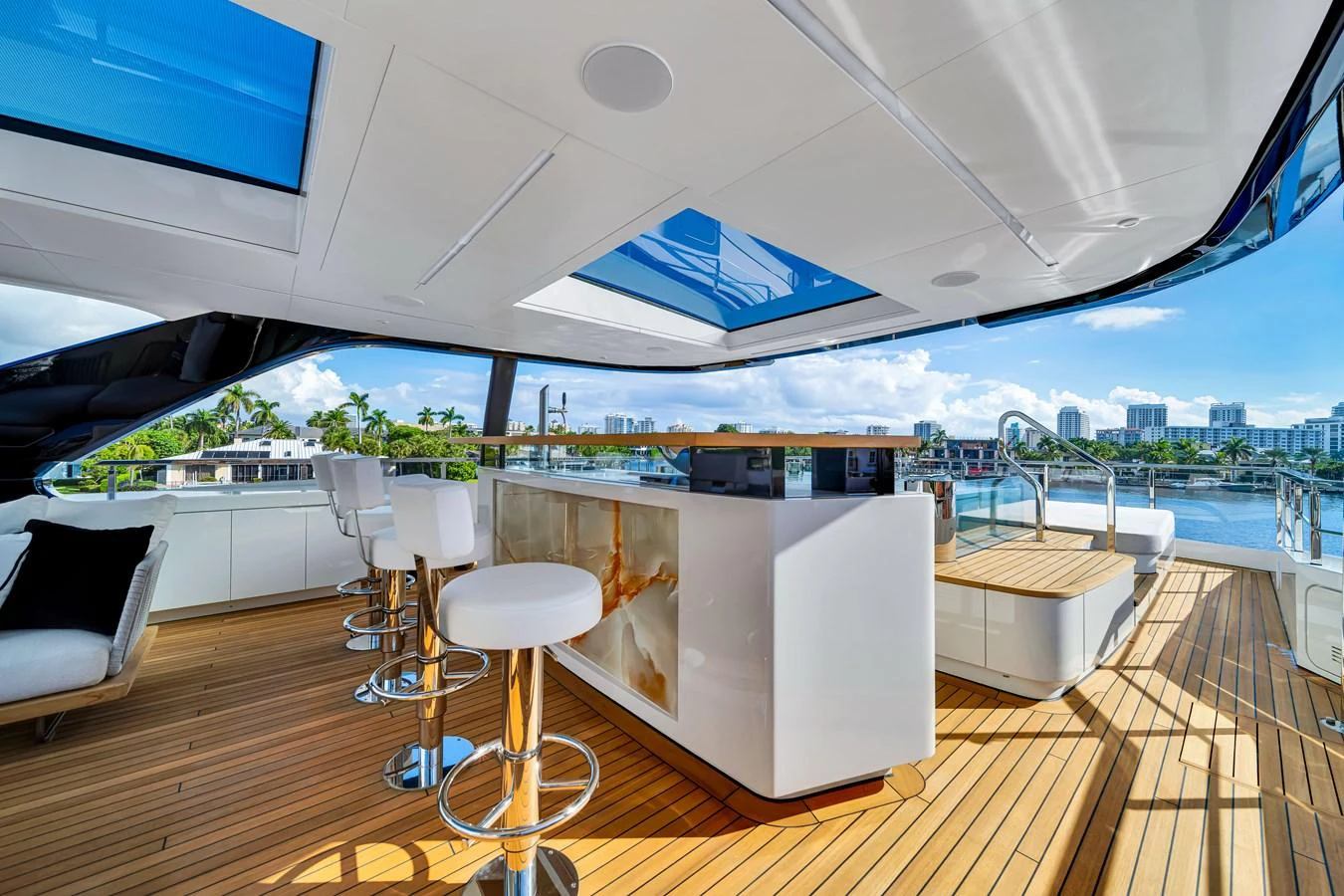 The flybridge features a stylish bar area with modern seating and expansive views. aboard BAGLIETTO DOM 133 #5 Yacht for Sale