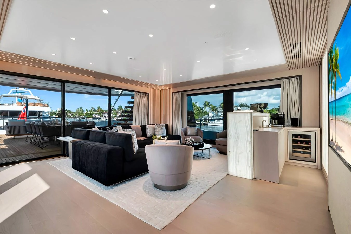 The salon offers a spacious and luxurious seating area with large windows providing stunning views. aboard BAGLIETTO DOM 133 #5 Yacht for Sale