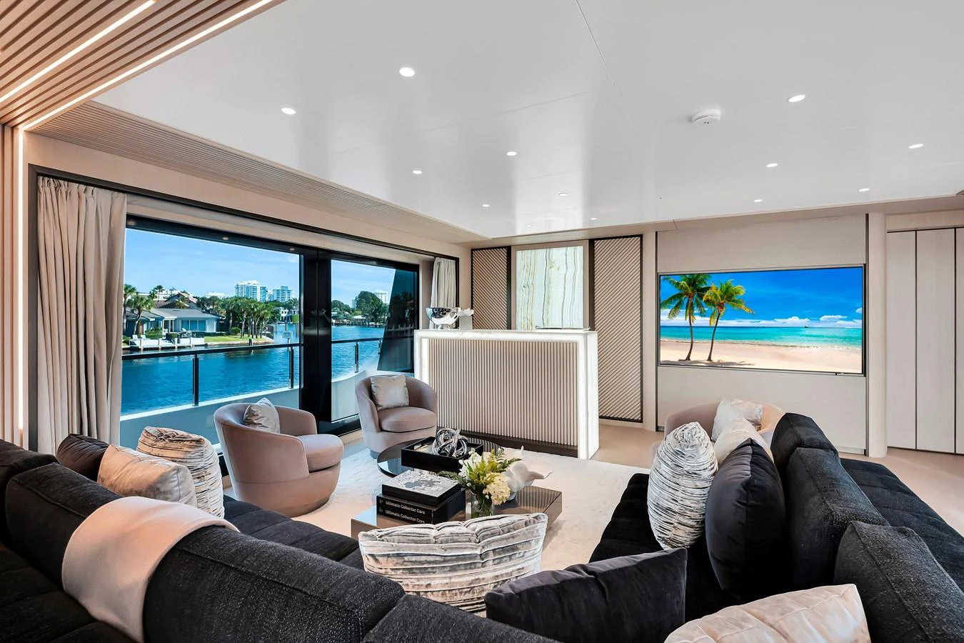The salon offers a luxurious and spacious seating area with large windows providing stunning water views. aboard BAGLIETTO DOM 133 #5 Yacht for Sale