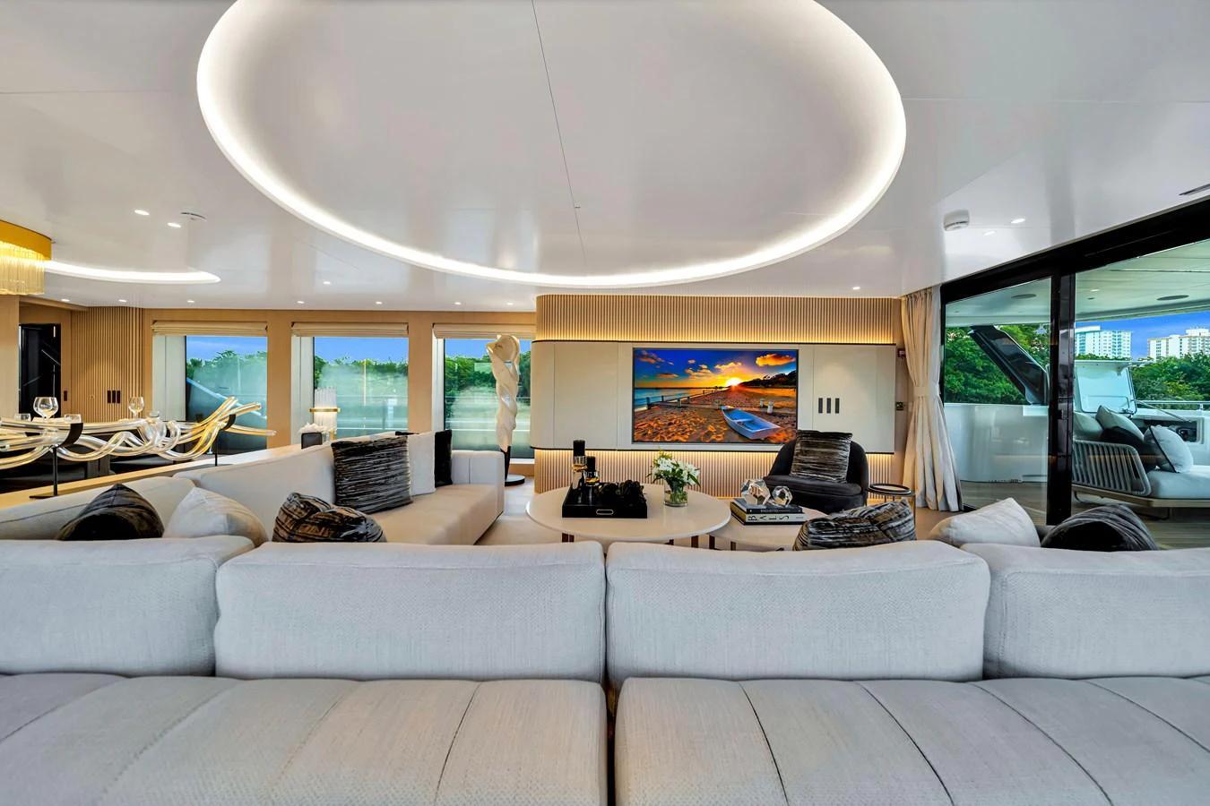The spacious salon features modern furnishings and a large flat-screen TV, creating a luxurious and comfortable living area. aboard BAGLIETTO DOM 133 #5 Yacht for Sale