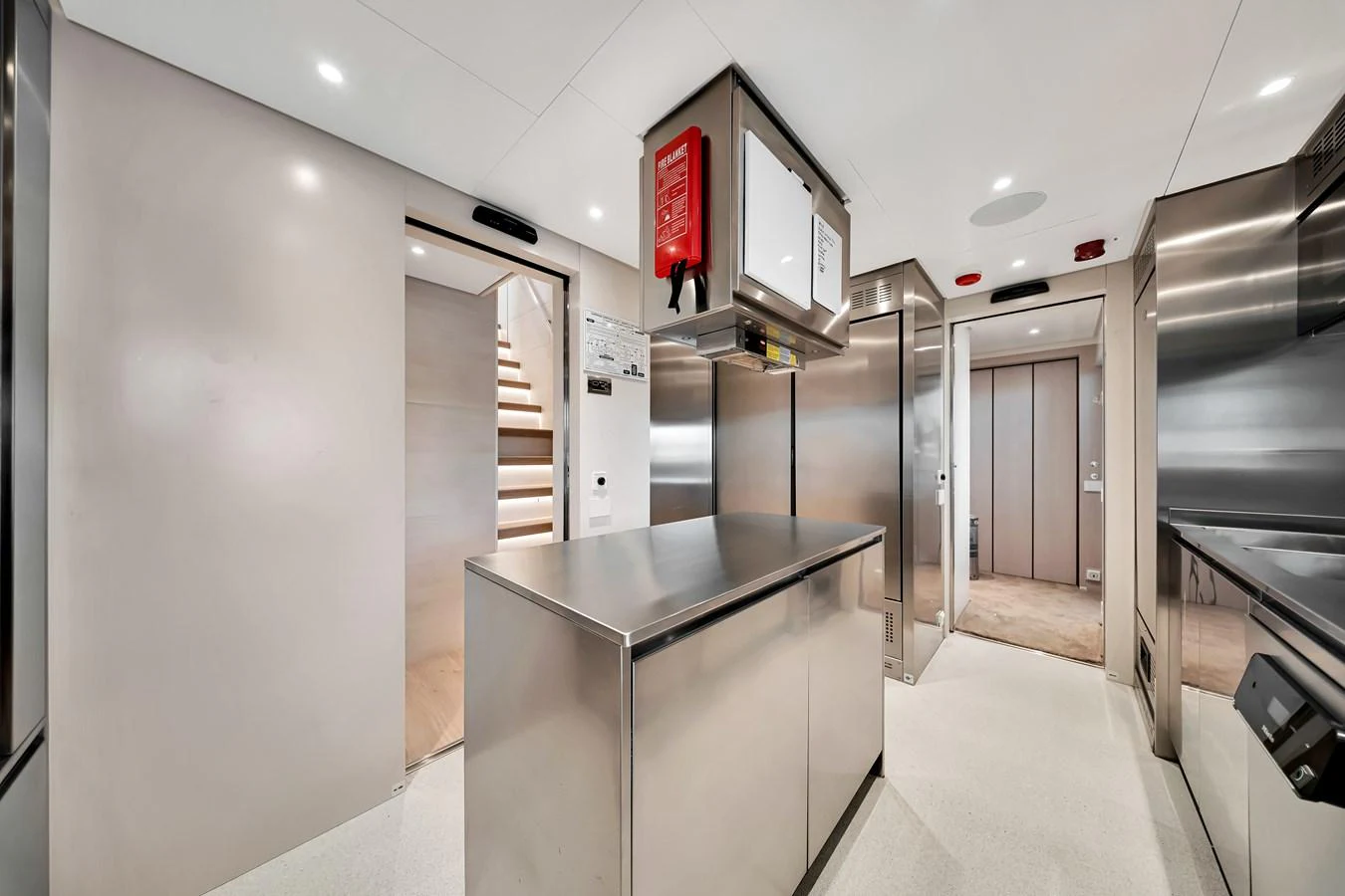 The yacht's galley features sleek stainless steel surfaces and modern appliances. aboard BAGLIETTO DOM 133 #5 Yacht for Sale